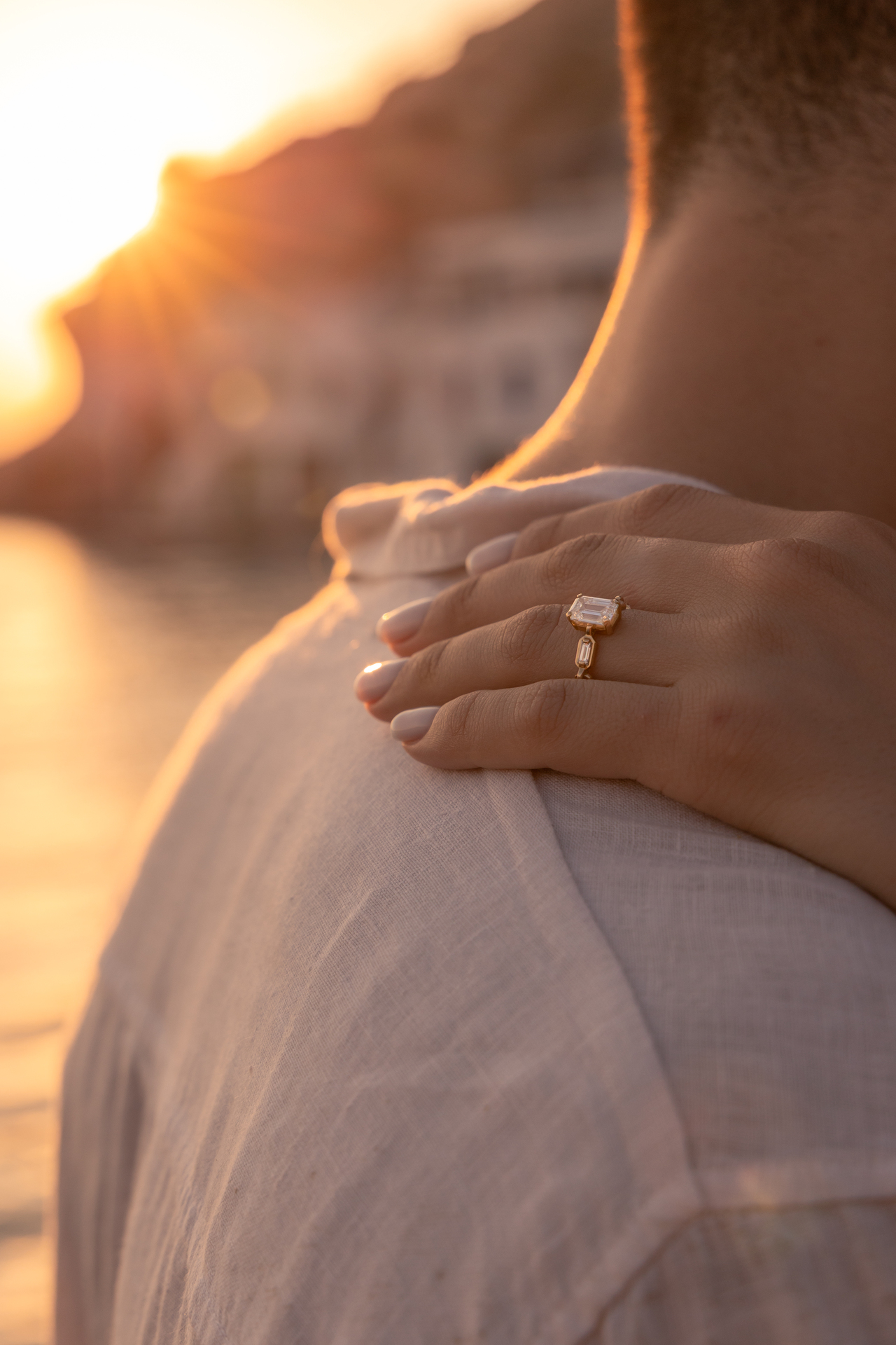 Couple at sunset on Kleftiko cliffs, Milos