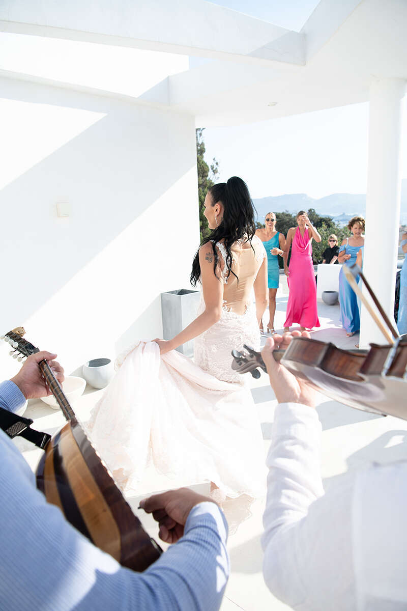 Wedding couple on the volcanic coastline of Milos